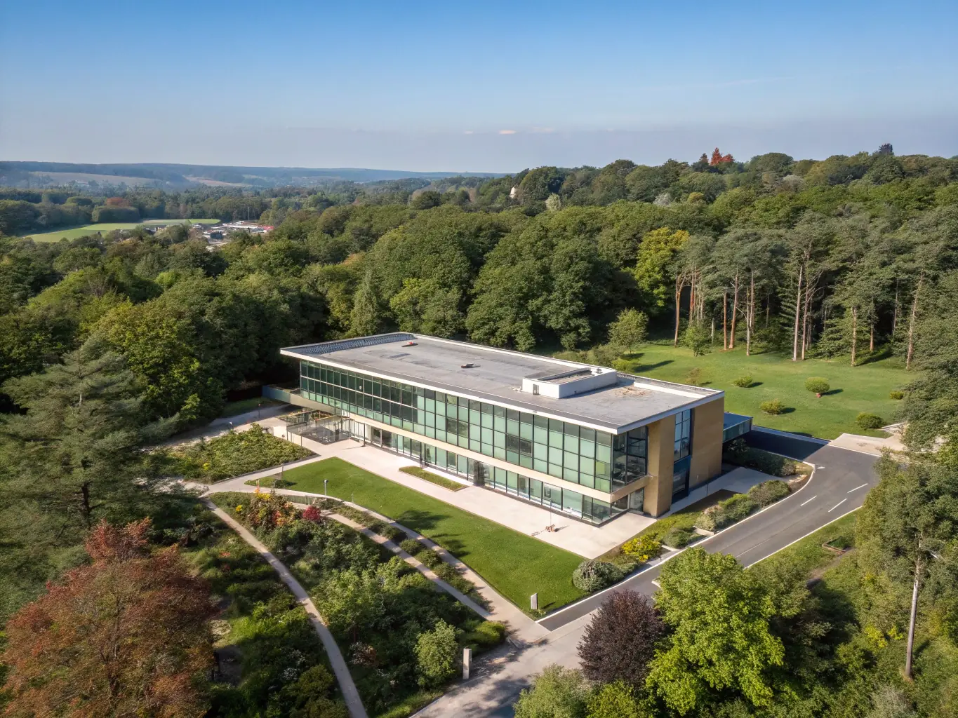 A modern hospice facility with comfortable patient rooms and serene outdoor spaces, emphasizing compassionate end-of-life care.